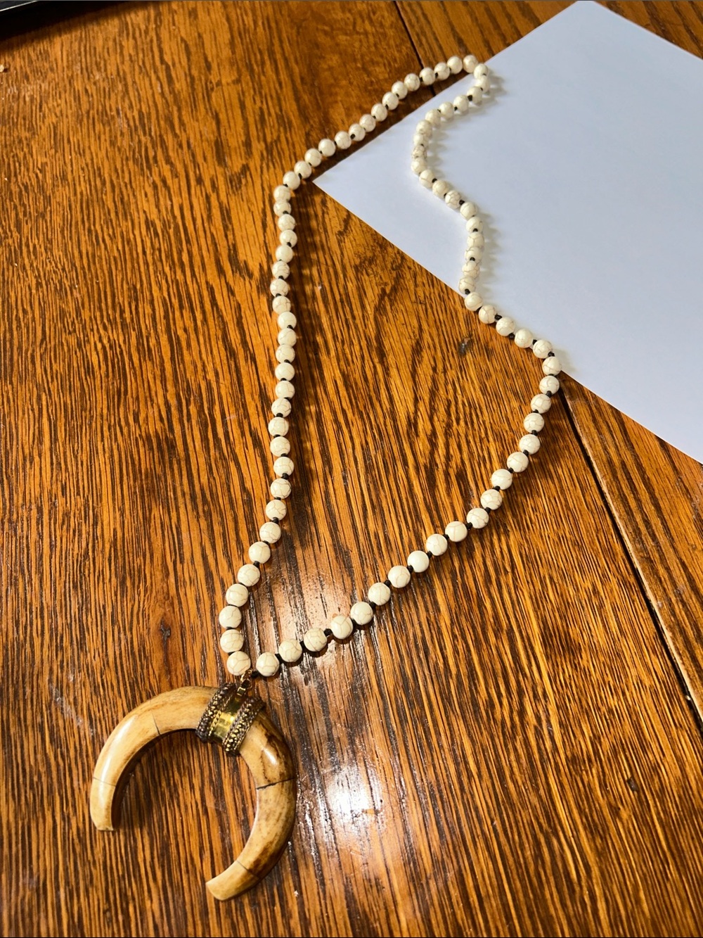 Natural Cream Bead Necklace with Crescent Horn Pendant